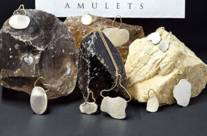 Potere Amulets: Where Ancient Symbols Meet Fine Engraved Pendant Jewelry