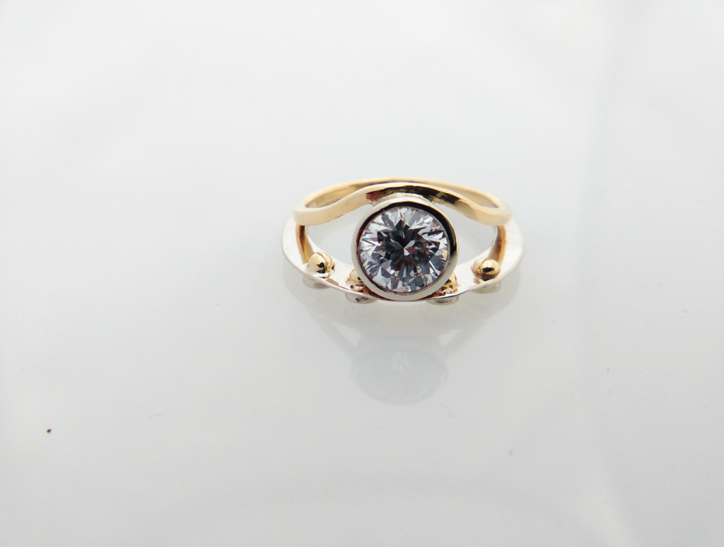 Contemporary engagement ring supplied by Spencer and Kuehn
