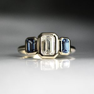 Three Stone Emerald Cut Diamond and Sapphire Engagement Ring