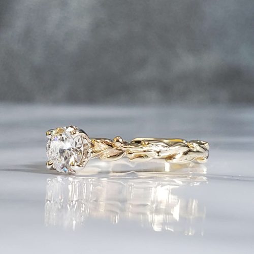 Dainty carved leaf Solitaire engagement ring and 14K yellow gold and 14K white gold leaf accented setting.