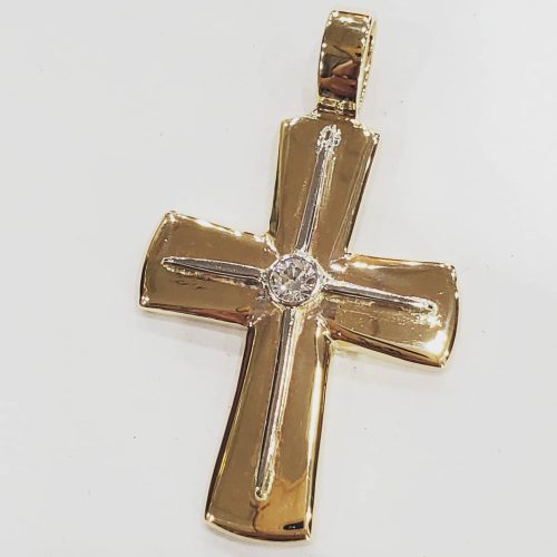 14k yellow gold cross pendant with a white gold star accented bezel set diamond.