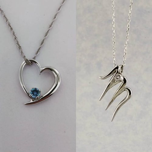 14k white gold heart with a blue diamond and a cursive "M" with diamond accent.