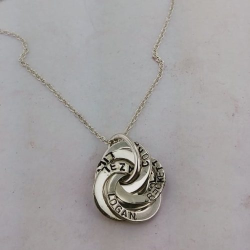 Sterling silver family knot pendant with engraved names.