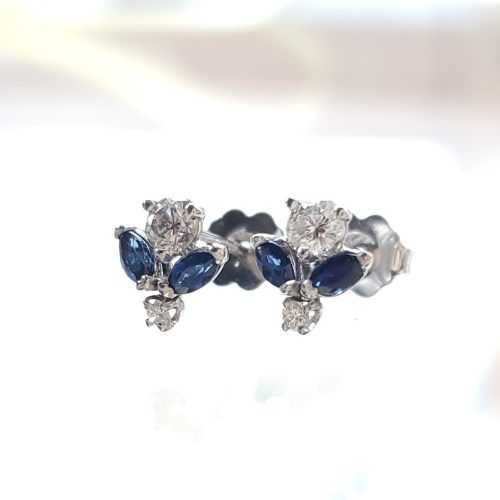 Round diamonds and marquise blue sapphires all prong set in 14k white gold studs.