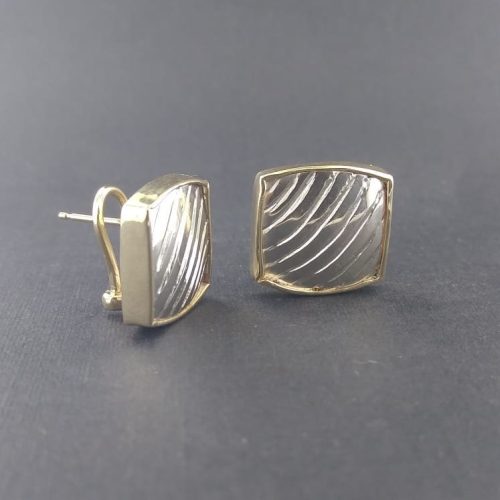 Carved sterling silver bezel set in 14k yellow gold.