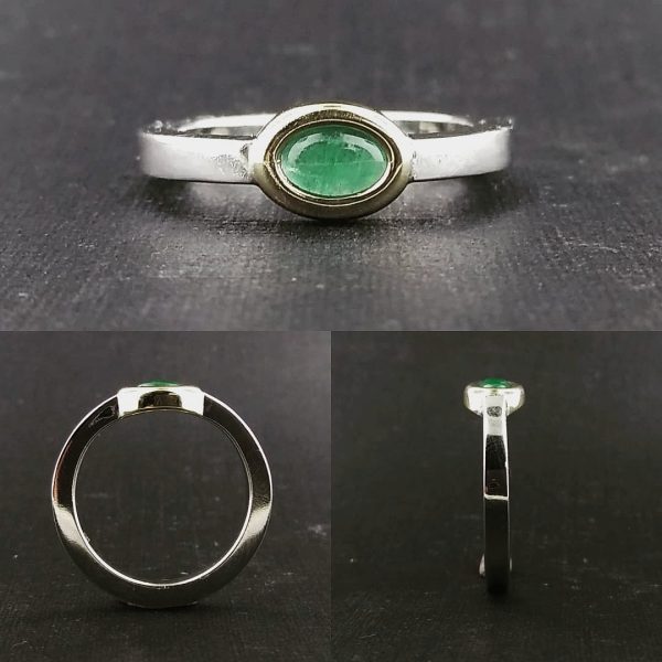 Cabochon emerald, bezel set in an eye shaped opening on a 14k white gold band, alternative engagement ring, unique. Item 1007