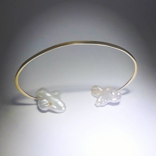 14k yellow gold dainty cuff with two organic shaped peals on each end.