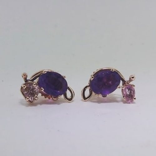 Oval amethysts with pear pink topaz accents set in 14k rose gold.