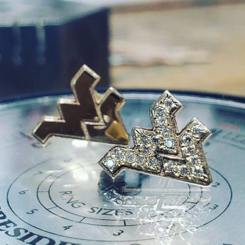 Diamond flush set flying WV studs in 14k yellow gold.