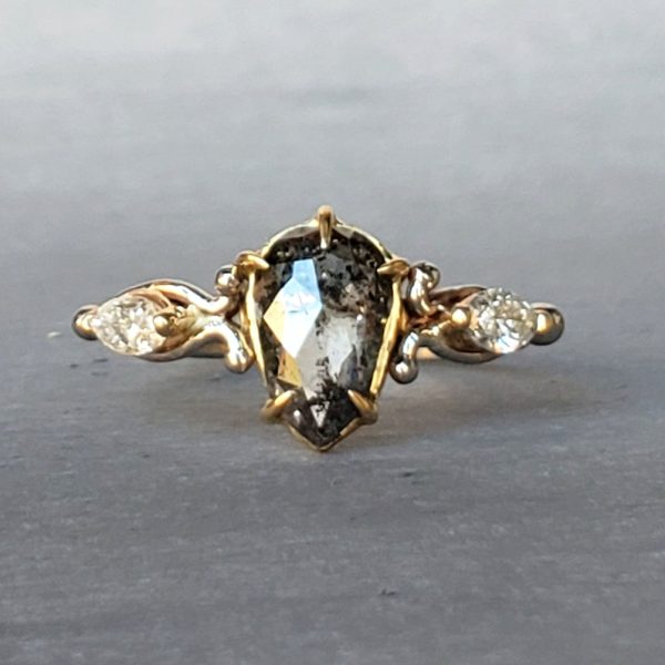 Rose cut salt and pepper pear shape diamond, prong set in 18k yellow gold with marquise diamonds and 14k white gold vine accents.