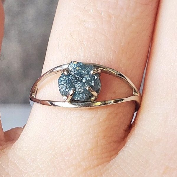 Solitaire uncut blue diamond prong set on an open 14k white gold band, alternative engagement ring, blue diamond, raw diamond. Item 1006