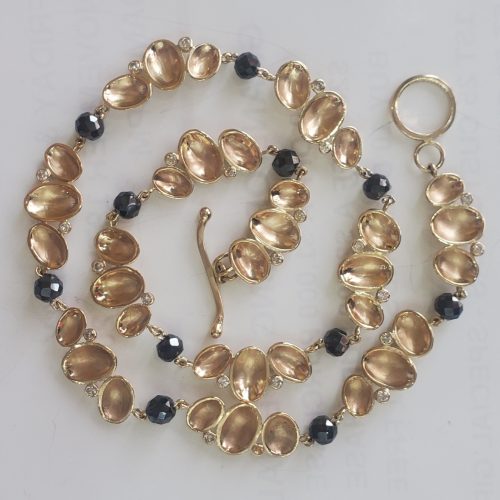 14k yellow gold pebble clusters with alternating black diamond beads and a toggle clasp.