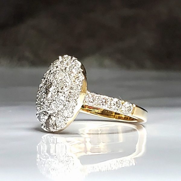 Fully faced pave set diamonds, on a diamond accented band, all set in 14k yellow gold.