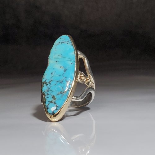Hand cut semi-free form bezel set turquoise ring in sterling silver with 14k yellow gold ball accents. Designed by Katheirne Spencer. Created by Yonaton Benjoseph. Made in Morgantown, West Virginia USA