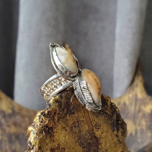 Round white diamond, bezel set on an open band 14k yellow gold ring with top accents and a matching contour band with a flush set diamond accent.
