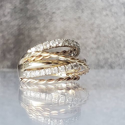 Bezel set marquise white diamond on a knife edge 14k white gold band.