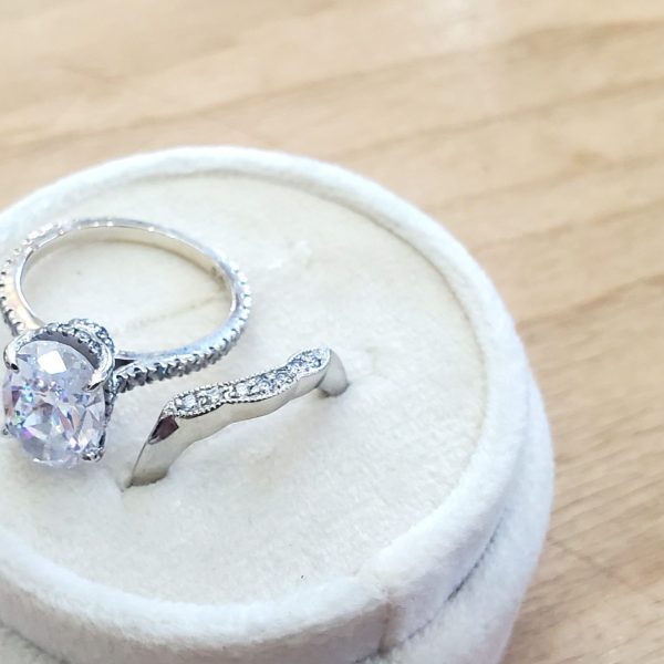 Dainty contour wedding band in 14k white gold with diamonds.