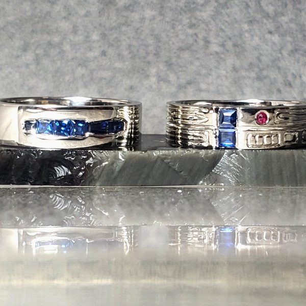 Theme Wedding Band Set with natural blue sapphires and ruby set in 14k white gold. Created by Katherine Spencer in Morgantown, West Virginia, USA