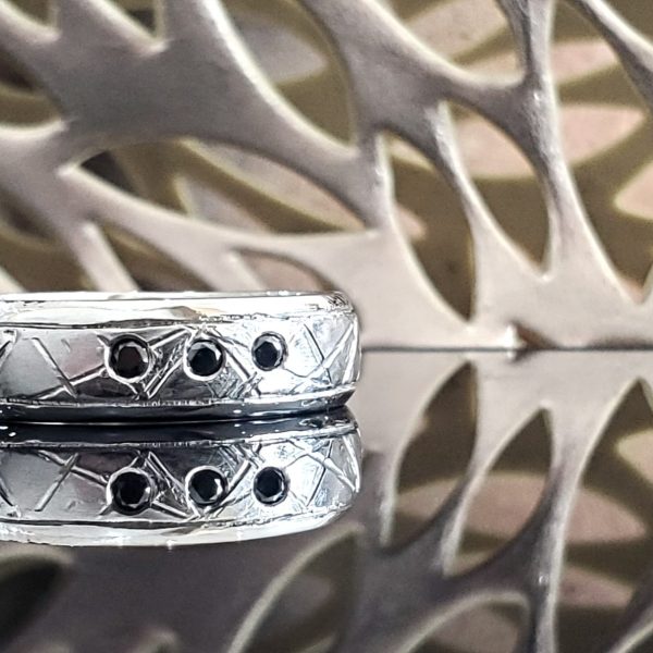 Meteor style Men's Wedding Band Wedding Band in 14k white gold and flush set black diamonds. Created by Shea Tronco in Morgantown, West Virginia, USA