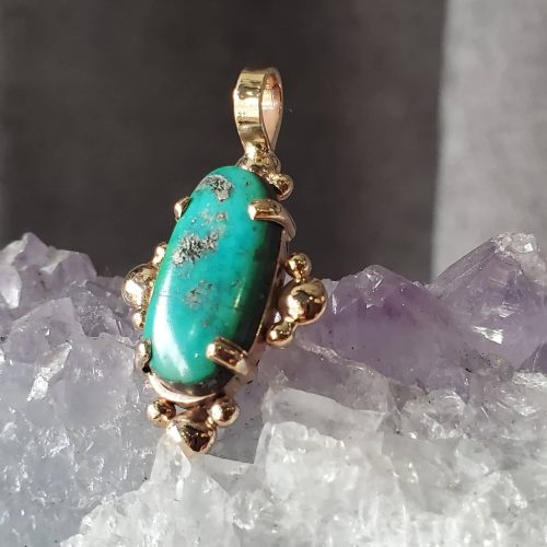 Blackened .925 sterling silver with 14k yellow gold cut out accents, and a prong set cabochon citrine