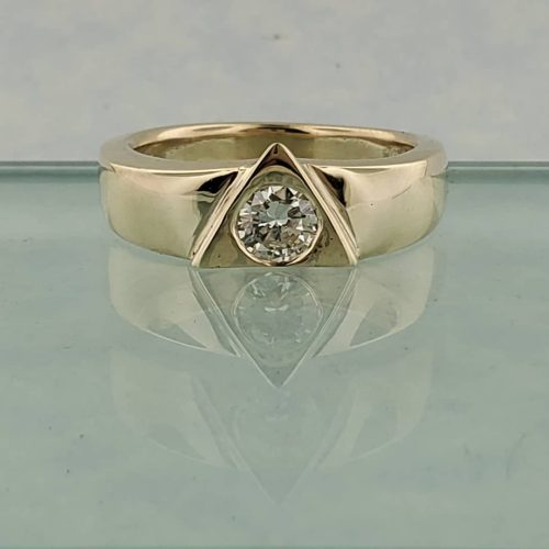 Flower ring created in 14k rose gold with diamond accented band, and imperial topaz flanked with leaf form emeralds, peridot, and tsavorite garnet