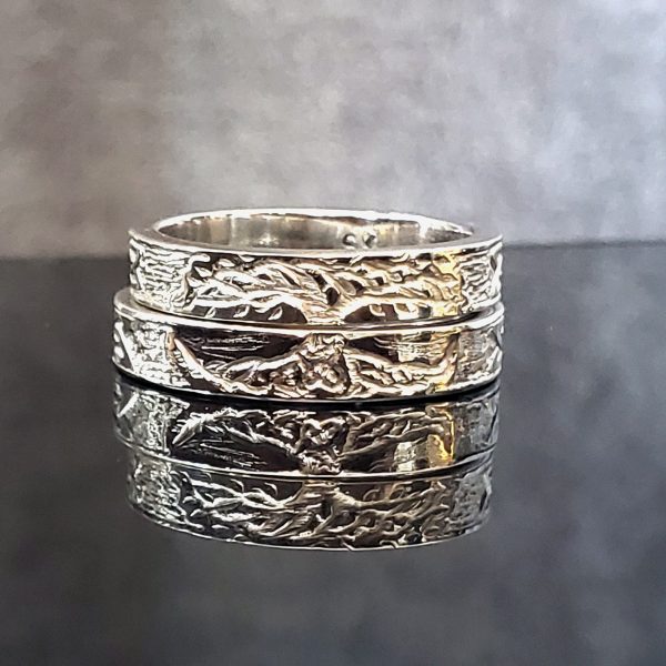 Hand carved Tree of Life Matching ladies and men's Wedding Band Set in continuum silver. Created by Katherine Spencer in Morgantown, West Virginia, USA