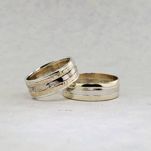 A trio of family diamonds set in a 14k yellow gold open filigree ring