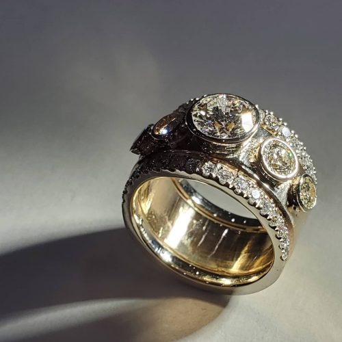 Bezel set marquise diamond with a French set diamond halo, on a 3 row diamond band in 14k yellow gold. Made by Katherine Spencer in Morgantown, West Virginia USA