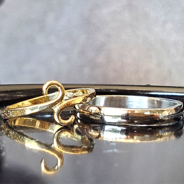 18k yellow gold ladies Swirl wedding band and half-round thin men's wedding band. Created by Katherine Spencer in Morgantown, West Virginia, USA