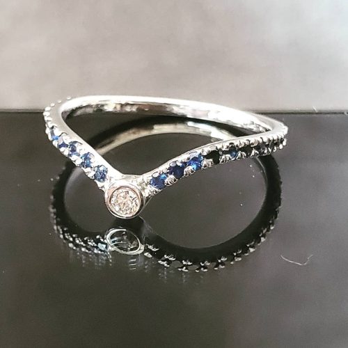 14k yellow gold bezel set round diamond and turquoise ring.