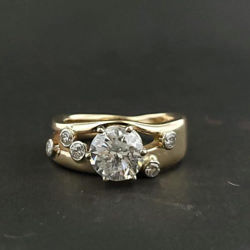 14k white gold diamond halo engagement ring with a contoured diamond band