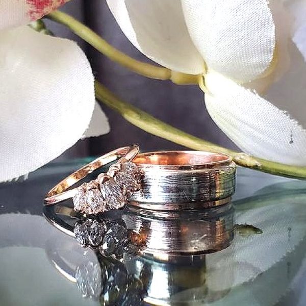 Rose gold 5 stone marquise diamond band and Rose gold band with Mokume Gane inlay. Created by Katherine Spencer in Morgantown, West Virginia, USA