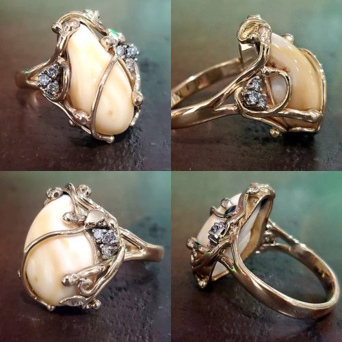 Bezel set round diamonds on a wide 14k yellow gold band with accented diamond bands on top and bottom. Made by Katherine Spencer in Morgantown, West Virginia USA