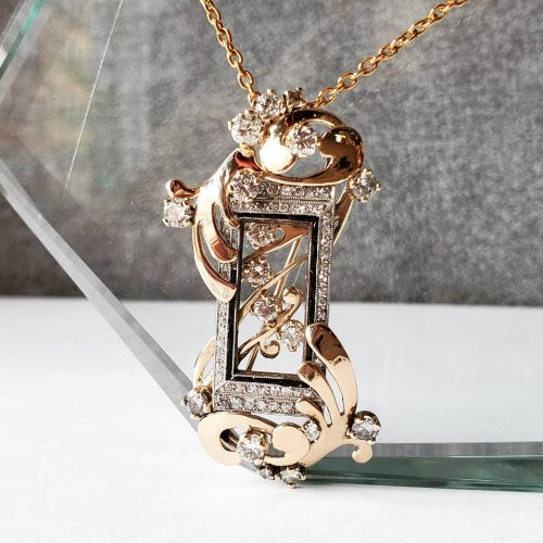 Hand cut out "Emily" nameplate necklace in 14k yellow gold, on a gold cable chain with an accent diamond in the "i".