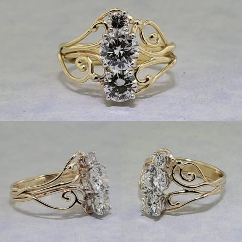Large bezel set diamond set in a swirl 14k white gold band.