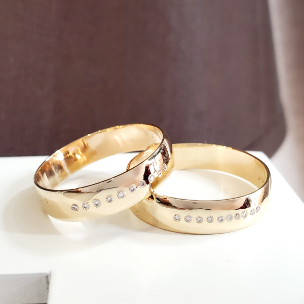 Matching men's Wedding Band Set in 10k yellow gold with 10 Diamonds each. Created by Katherine Spencer in Morgantown, West Virginia, USA