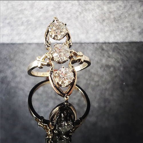14k yellow wide band with multiple bezel and flush set diamonds