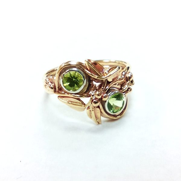 Two round green peridot enclosed in a leaf and vine 14k yellow gold band, two stone engagement ring, alternative, nature inspired.