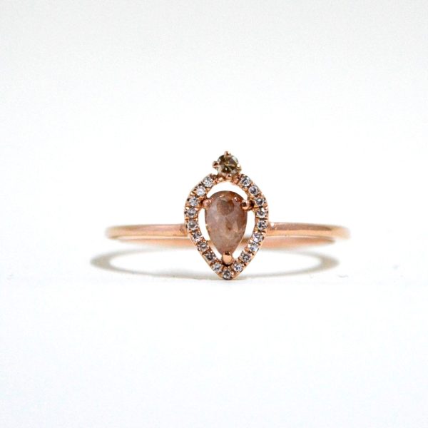 14k rose gold ring with a pink rose cut salt and pepper diamond with a diamond halo.