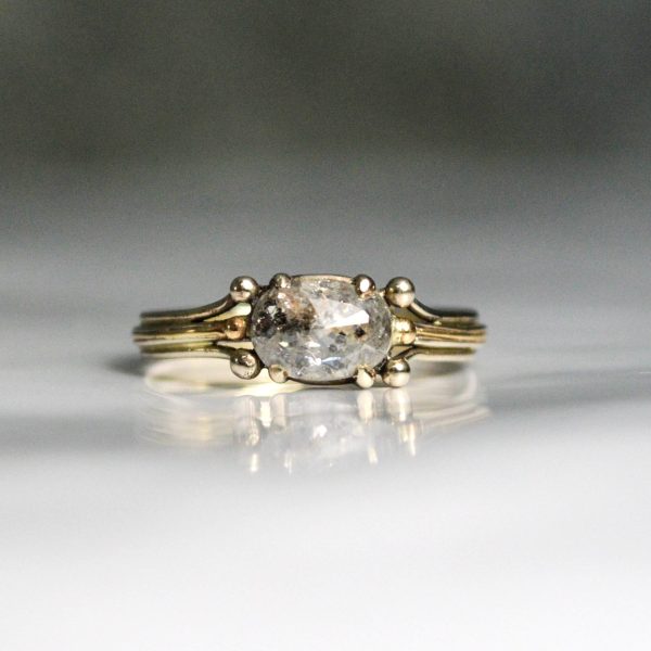 Beautiful oval rose cut salt and pepper diamond, prong set, on a band of vines, crafted out of 14k white gold, rustic and alternative engagement ring option. Item 1010