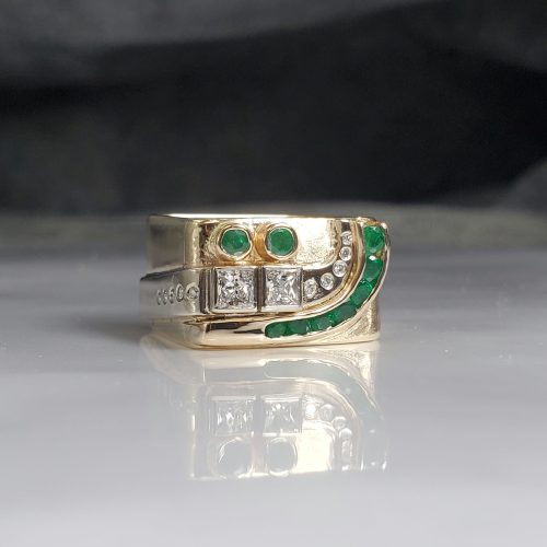 Modern style square ring in 14k gold setting with green emeralds and princess and round white diamonds.